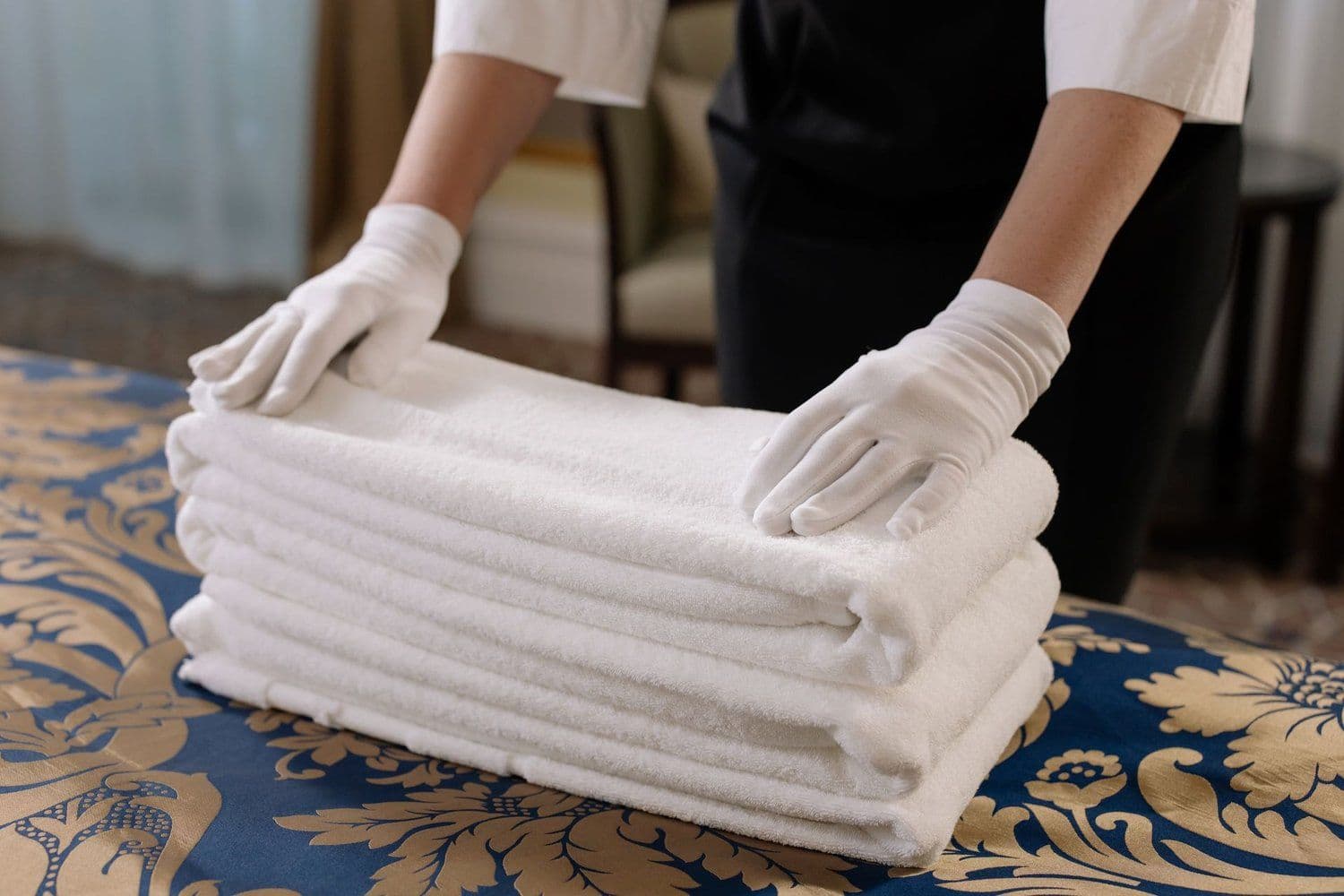 Neatly stacked, freshly laundered white towels